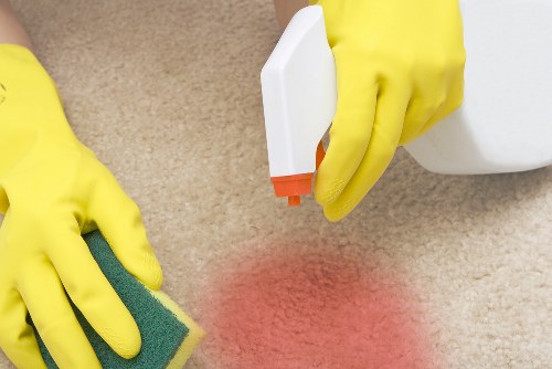 Carpet cleaning team preparing equipment with safety focus