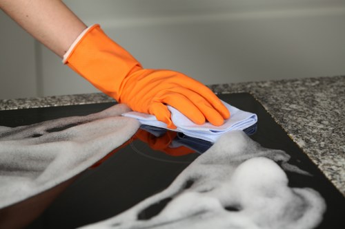 Cleaner preparing a home clean in an E1 flat