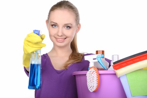 Experienced carpet cleaner working on a carpet in E1